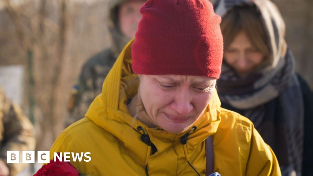 Fearing Russia will seize her town, war widow moves husband's grave to Kyiv